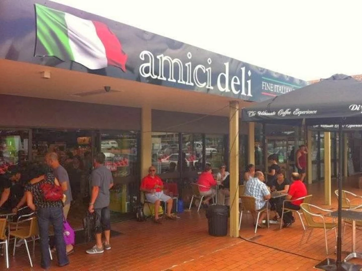Friends gathering outside Amici Deli on Gympie Road